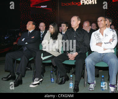 l-r Silvio Berlusconi , Van Damme`s daughter Bianka , Russian President Vladimir Putin and actor Jean Claude Van Damme at the fight tournament in St.Petersburg. Stock Photo